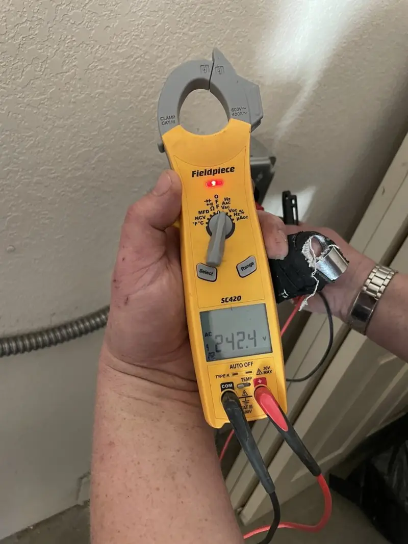 Voltage testing with clamp meter during Recessed Lighting Installation in Hilmar-Irwin